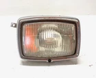 1998 Kawasaki Bayou KLF300 Headlight Assembly 23007-1274 Used. Price: $17.50.